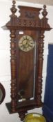 A last quarter of the 19th Century Vienna Style Wall Clock, with stained wood case, circular dial