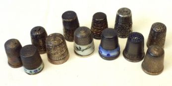A collection of five hallmarked Silver Thimbles, one with enamelled band, two white metal