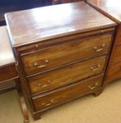 An early 19th Century Mahogany Bachelors Chest with moulded edge, over a brushing slide, three