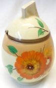 A Clarice Cliff Daffodil Preserve Pot, decorated with a “Sundew” design, 5” high.