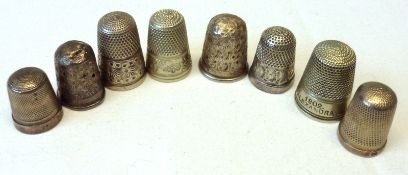 A collection of five hallmarked Silver Thimbles (conditions vary); a Sterling example and two