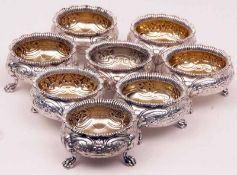 Eight George IV Cauldron Salts, each of typical form with cast and applied gadrooned rims, to floral