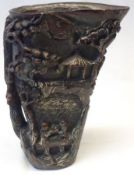 An Ox Horn Libation Cup, decorated with pagodas, figures, river barge, etc, 20th Century, 6 ½” high.