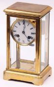 A late 19th/early 20th Century French Brass four glass Mantel Clock, the Japy Freres cylindrical