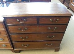 A Georgian Mahogany five drawer Chest, top with cross banded detail, with two half-length and