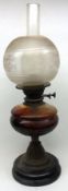 A late Victorian/early 20th Century Oil Lamp, on Slag Glass base, to a Brass column, with opaque