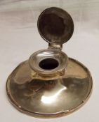 A large early 20th Century Capstan Inkwell with loaded tray form base, plain hinged lid, marks