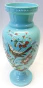 A French Glass baluster Vase, painted in colours with a bird and foliage on a pale blue ground, with