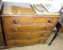 A 19th Century Oak Chest with four full length drawers and turned knob handles, raised on bracket