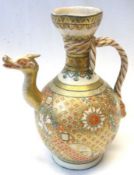 A Satsuma Ewer applied with a knot handle and the spout formed as a single horned dragons head, (