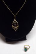 An Art Nouveau yellow metal openwork Pendant set with Seed Pearl and Amethysts mounted on a yellow