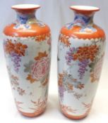 A pair of Kutani large baluster Vases, each decorated predominantly in iron red, with further