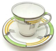 An Aynsley art deco style Tea Cup and Saucer, decorated in yellow, silver and green, 3” high