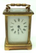 A late 19th/early 20th Century French lacquered Brass Carriage Timepiece, unsigned, the enamelled
