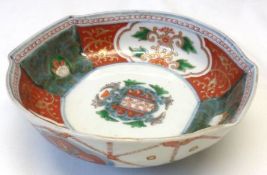 An Imari Armorial Dish of two handled oval form, the inner rim painted in colours with floral