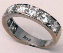 A high grade precious metal Half Eternity Ring set with eight brilliant cut Diamonds of