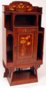 A good late 19th Century Mahogany art nouveau Music Cabinet, the single door well inlaid with a