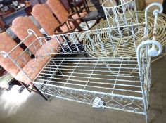 A late 19th/early 20th Century rectangular wire work Garden Seat with scroll ends, raised on four