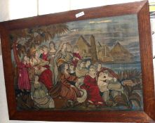 An Oak framed Wool Work Picture of a Classical scene with Figures by a Riverside, 33” long (damage