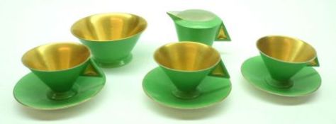 A Shelley Vogue shape part Tea Service comprising: three Cups and Saucers, Cream Jug and Sugar