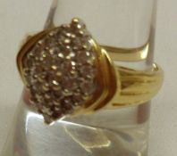 An unmarked yellow metal marquise panelled Ring with small brilliant cut Diamonds (.5ct total).