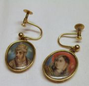 A pair of yellow metal frame screw-on Earrings, each with hand painted oval panel of an Egyptian