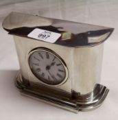 A George V Silver encased Boudoir Timepiece, the polished break front plinth shaped case with over