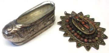An Oriental white metal Match Holder modelled as a shoe, embossed with dragons, etc, with clear