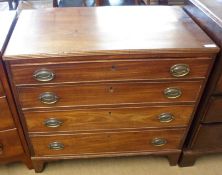 An early 19th Century Mahogany Chest with four graduated drawers and oval Brass handles, raised on