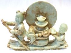 An Oriental Hard Stone Carving of Figures on a Raft, 10 ¼” long and 8” high.