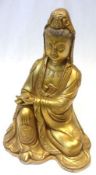 A 20th Century gilded Oriental Bronze Figure of a seated Deity, her right hand resting on her knee