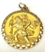 A hallmarked 9ct Gold St Christopher Pendant 26mm diameter and weighing approximately 8 ½g.