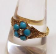 A Victorian period unmarked Gold five Turquoise and centre small Diamond ring of flower head design,