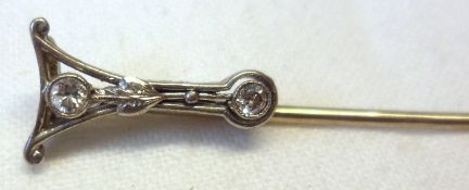 An unmarked precious metal Stickpin, a ‘Y’ shaped finial featuring two small brilliant cut Diamonds.