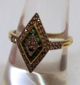 A high grade precious metal Art Deco style marquise shaped Cluster Ring set with bands of small