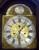 An Oak Long Case Clock, the arched pediment surmounted by three gilded ball finials, arched Brass