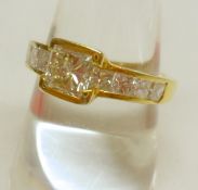 A high grade precious metal Ring set to the centre with a Princess cut Diamond of approximately.6 ct