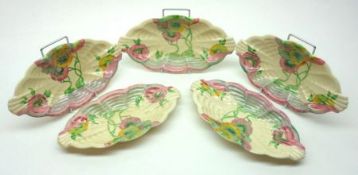 Five Clarice Cliff Rhodanthe shaped oval Side Plates, decorated in a green, yellow, blue and pink