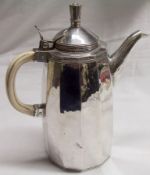 An Edward VIII Coffee Pot of hammered 12 sided tapering construction with a hinged and domed