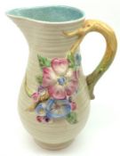 A Clarice Cliff Apple Blossom patterned Jug, decorated with floral embossed detail, to a branch