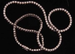 A high grade precious metal all brilliant cut Diamond line Necklace, approximately 6.42ct total,