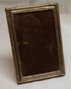An Elizabeth II small rectangular Silver mounted Photograph Frame with wavy beaded edges, wooden