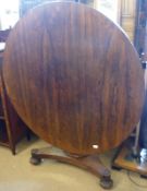 A 19th Century Rosewood pedestal Breakfast Table, the round flip-top to a heavy balustered column,