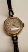 A Ladies Vintage 9ct Gold Cased Wristwatch with silvered dial, octagonal bezel, leather strap,
