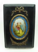 A 19th Century painted oval Porcelain Plaque, decorated with two young lovers, painted in colours