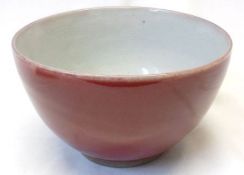 A 20th Century small Chinese Sang de Beouf Bowl of plain tapering circular form, 4 ¾” diam.