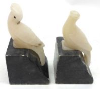 A pair of small polished Marble Bookends modelled as perched cockatoo’s, 4” high