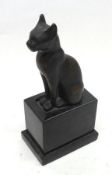 An art deco period Bronze Model of a seated cat in Egyptian style, upon a black Marble base, 7 ½”