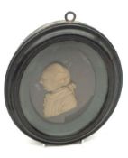 A Vintage poured wax Bust of a 19th Century Figure, (A/F), in an oval glazed wooden frame, 7” long