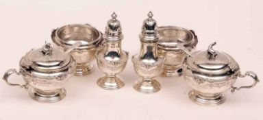 A good quality George V Condiment Set of circular form, with applied shell and scroll detail,